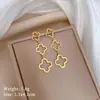 [Acero de titanio de cuerpo completo] borla de hierba de la suerte aretes de estilo muy simple aretes fríos para hombres y mujeres personalidad temperamento aretes de banquete