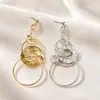 Pendientes de borla de metal plisado redondo anudado estilo europeo y americano Pendientes de botón versátiles Pendientes de atmósfera nicho Aros para orejas de mujer