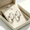 Aretes de plata pura huecos para dinero para mujer, lujo puro, moda de alta gama, elegantes y auspiciosos, aretes de diseño de nicho