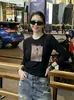 Fábrica de Origen Guangzhou Shisanxing Top de Algodón Ajustado de Manga Larga para Mujer, Segunda Entrega de Verano, Cuello Redondo, Exclusivamente para Mayoristas