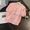 Conjunto de verano nuevo para mujer con diseño de moda estilo europeo: conjunto de dos piezas: top de punto colorido de cuello redondo con botones y falda vaquera de manga corta