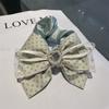 Perla amor mariposa dos puntos círculo 2023 Nueva Ola punto tocado femenino hecho a mano accesorios para el cabello de alto sentido venta al por mayor de fábrica