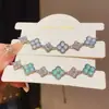 Pulsera de trébol de cuatro hojas de circón para mujer, joyería floral de diseño de nicho de lujo ligero, pulsera de temperamento de moda de alta gama