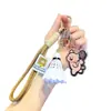Boneca de cachorro de desenho animado bolsa de boneca pingente de bolsa bolsa mochila de casal pingente de badminton chaveiro atacado