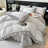 Juego de ropa de cama de cuatro piezas de terciopelo de leche de alta densidad con relieve 2026, con sábanas de franela espesas y cálidas, funda de edredón y sábana bajera acolchada antideslizante