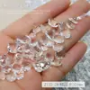 Venta al por mayor a través del fondo del diamante desnudo blanco glaciar joyería para uñas hielo a través de la roca caramelo corazón torcido transparente fondo puntiagudo diamante de uña decoración de diamante grande