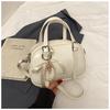 Primavera 2026 Nuevo Estilo Simple Nicho Moda de Gama Alta Versátil Celebridad de Internet Popular Venta Caliente Bolso Boston para Mujer de un Solo Hombro y Cruzado
