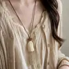 Nuevo collar retro de estilo chino con borlas y motivos de frutas, de inspiración étnica, lujo ligero, sensación de alta gama, cadena para suéter, accesorio de diseño de nicho
