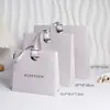 Nuevas bolsas de papel, bolsas de mano, bolsas de regalo, bolsas de regalo para cosméticos y labiales con logo impreso de Fuchen