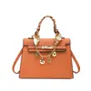 Bolso de mujer de nicho de alta gama 2026 nuevo de primavera vintage versátil bandolera bolso de mano versátil casual bolso tipo Kelly