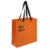 Bolsa de tote de papel recubierto impresión de LOGOTIPO personalizado fabricante venta al por mayor naranja bolsa de regalo bolsa de compras impresión personalizada