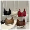 Bolsa Tote de Ombro Tecida de PU Moda Popular 2025 Nova Bolsa de Mensageiro Grande Capacidade Design Simples de Nicho Bolsa de Axila