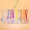 Lanyard creativo para teléfono con forma de lazo, cordón trenzado, cordón anti-pérdida, accesorio para llavero, charm para bolso, material hecho a mano, accesorios al por mayor