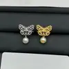 Nuevos Pendientes Retro de Mariposa Hueca Dior para Mujer Primavera Temprana 2025 con Agujas de Plata y Pendientes de Perlas Cd Venta al por Mayor