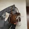 Bolsa Pequena Simples Estilo Coreano Feminina 2026 Nova Bolsa de Mão com Textura Trançada Bolsa Transversal Casual da Moda Bolsa Quadrada Pequena Tendência