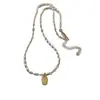 Collar de cuentas de mijo con colgante ovalado dorado para mujer, cadena para la clavícula de lujo ligero vintage de nicho, accesorio elegante y versátil