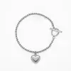 Nuevo brazalete de acero inoxidable estilo europeo y americano que no se decolora, moderno corazón, copo de nieve, trébol de cuatro hojas, perla colgante joyería para mujer