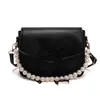 Bolsa pequena de corrente de pérolas feminina 2026 nova popular moda casual textura laço bolsa de mão bolsa de ombro bolsa transversal
