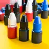 Tinta sensible a la luz para tampón secado rápido rojo botella pequeña tampón de tinta de color tampón de tinta sensible a la luz tampón consumibles especiales tampón de tinta al por mayor