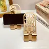 Ornatos de Mesa de Abóbora de Halloween Criativos Transfronteiriços Suporte de Exibição de Celular Oco de Madeira Suportes Preguiçosos Ornatos