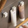 Estante para Pasta de Dientes Sin Taladro Montado en la Pared Limpiador Facial Baño Inodoro Estante Pared Clip de Almacenamiento para Pasta de Dientes