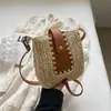 Bolso tejido estilo étnico bohemio para mujer 2026 nuevo bolso de paja para vacaciones en la playa bolso de teléfono de un solo hombro cruzado