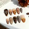 30 Piezas de Uñas Portátiles de Almendra de Boutique Transfronteriza Uñas Portátiles Flor de Cruz Dorada en Relieve Estéreo 3D Piezas de Manicura