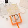 Estilo Nacional Caja Transparente de Película de PE Colgante Caja de Empaque para Pulsera Joyería Caja para Anillo Pulsera Venta al por Mayor Logo Impreso