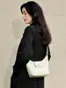 Nova bolsa de mão de couro genuíno tecida à mão estilo 'bolinho' 2026, uma bolsa transversal versátil e estilosa para o dia a dia, com design de luxo leve e elegante