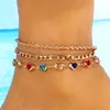 Conjunto de tornozeleiras de corrente com cristal de coração colorido minimalista transfronteiriço europeu e americano, acessório de pé de corrente de metal torcido da moda