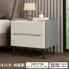 Mesita de noche de madera maciza para uso doméstico, dormitorio de lujo ligero, mesita de noche moderna simple de alta gama, modelo nuevo con cuero y panel de roca, almacenamiento pequeño