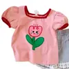 Moda Infantil Verão 2026 Nova Camiseta Estampada Floral Fofa de Manga Curta para Meninas e Crianças Pequenas Tops da Moda