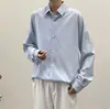 Camisa estilo Hong Kong cor pura solta com caimento para usar por baixo primavera e outono camisa de manga comprida masculina versão coreana ins top moderno bandido bonito