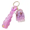 Nuevo Llavero Anillo de Botella con Muñeca de Arena Líquida, Colgante Exquisito de Dibujos Animados para Mochila para Niñas y Niños, Accesorio de Pareja, Pequeño Regalo para Eventos