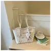 Bolso de axila de nicho francés para mujer 2025 Nuevo de moda a cuadros de mano para hombro de gran capacidad Bolsa tote para el día a día