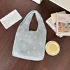 Bolsa Tote de Tricô Vazado para Mulheres 2026 Novo Modelo Grande Capacidade Bolsa de Ombro Trançada Design Único Bolsa de Mão