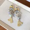 Brincos de Franja de Carpa em Concha Estilo Férias na Praia Moda Elegante Brincos de Luxo Leve High-End Brincos Atacado