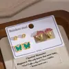 Pendientes de Tachuela de Trébol de Cuatro Hojas de Acero Inoxidable Rojo Dorado Más Vendidos Set de Tres Piezas para Mujer Redondo Incrustado de Diamante Joyería para Orejas Pequeña de Nicho con Acabado de Alta Gama