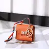 Nuevo Mini Bolso Kelly Llavero Colgante Cuerda de Mano Portátil Bolsa para Audífonos Bluetooth Monedero Bolsa Pequeña Multifuncional