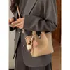 Bolsa de Balde Portátil Estilo Retrô Francês para Mulheres 2026 Inverno Novo Estilo Roupa Diária de Trabalho Bolsa de Ombro Nicho Casual Bolsa Transversal