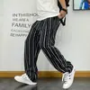 Pantalones casuales rectos a rayas de estilo coreano chic para primavera y otoño para hombre, estilo Harajuku, holgados, de pierna ancha, largos, para hombre y mujer.