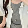 Collar con colgante largo ovalado hueco mate irregular, cadena para la clavícula casual de nicho de alta gama, cadena para suéter, accesorio para el cuello