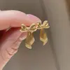 Nuevo traje de collar con lazo de cinta y pendientes de la serie años dorados tienda de oro con venta al por mayor de joyería