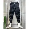 Marca de moda costura pantalones casuales para hombre línea brillante 2023 Verano nuevos pantalones bombachos ajustados overol bombacho juvenil de celebridad de Internet
