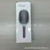 Un cepillo de pelo popular con cerdas grandes para mujeres y hombres con dientes anchos, adecuado para cabello largo, con cojín de aire y función de masaje, para uso doméstico