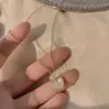 Collar de Luna y Corazón de Piedra Lunar Dulce y Soñador Estilo Francés de Celebridad de Internet, Cadena para Clavícula Iridiscente de Nácar de Lujo Ligero Nuevo Modelo 2026