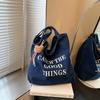 Nova bolsa jeans estilo coreano fashion com letras, bolsa de ombro casual de grande capacidade para mulheres, bolsa de compras portátil para deslocamento