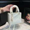 Estrella Simple y Puntos 2026 Primavera Nueva Moda Alta Calidad Textura Elegante Versátil Hombro Cruzado de Hombro de Mano Duquesa
