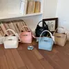 Bolso Kelly Sencillo con Patrón de Lichi para Mujer 2026 Nuevo Bolso Cubo Versátil de Cuero Suave con un Toque de Lujo, Bolso de Mano y Bolso Cruzado