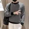 Otoño e invierno 2023 Nuevo suéter de punto grueso con cuello redondo para hombre, suéter a cuadros versátil, ajuste ceñido, manga larga para usar debajo